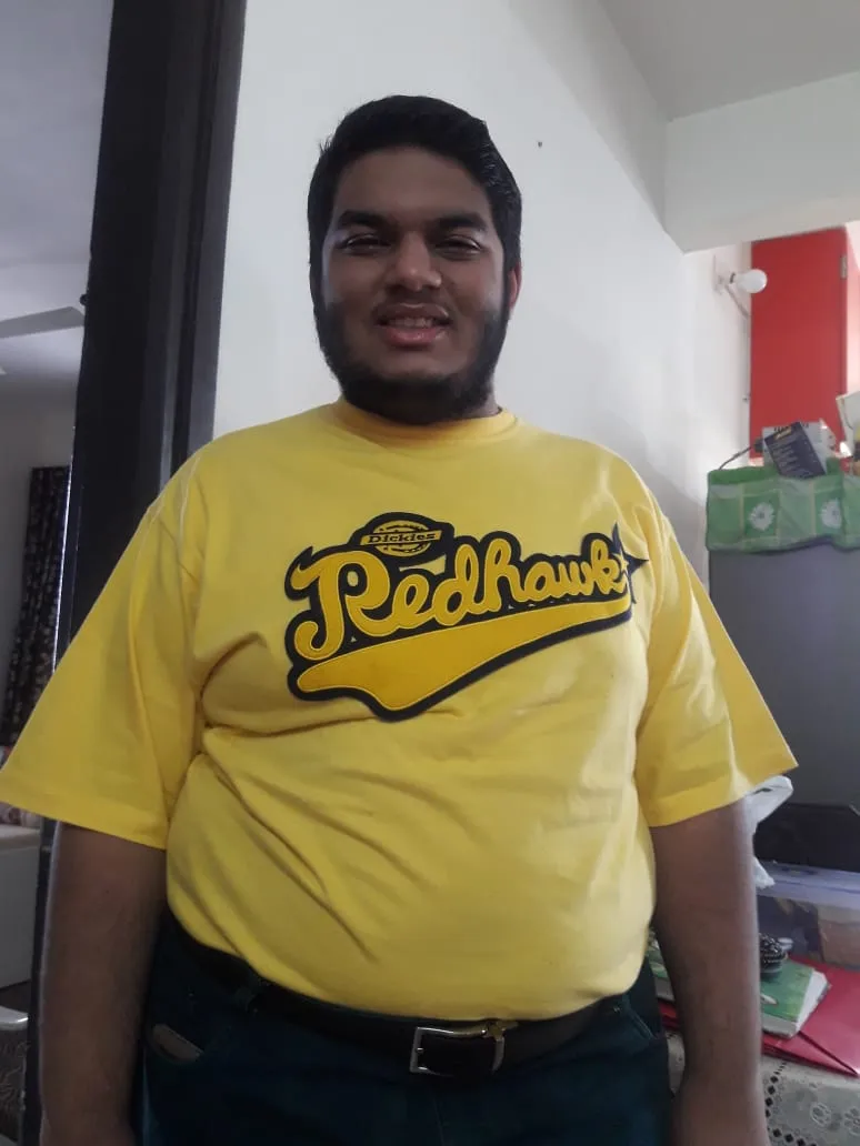 Coach before his fitness journey, in a yellow t-shirt