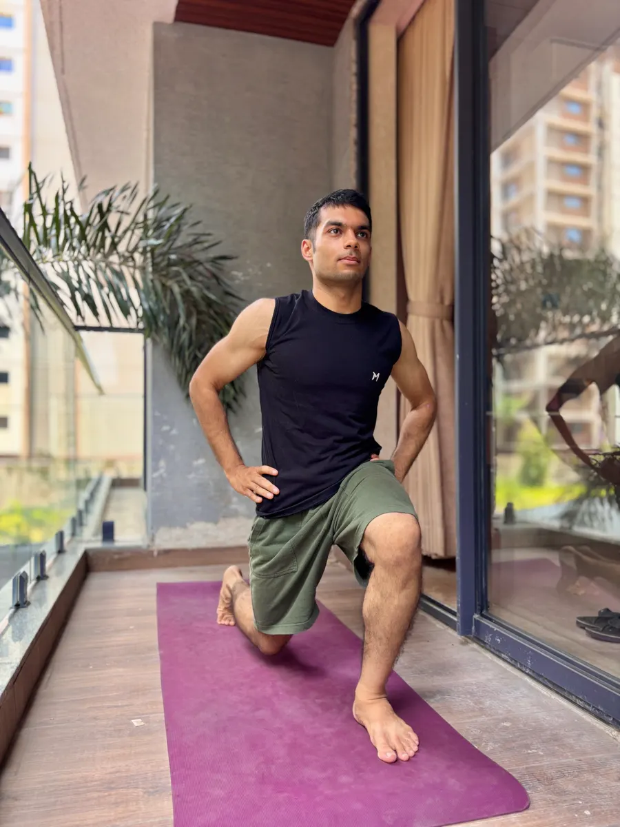 Coach stretching on a balcony yoga mat